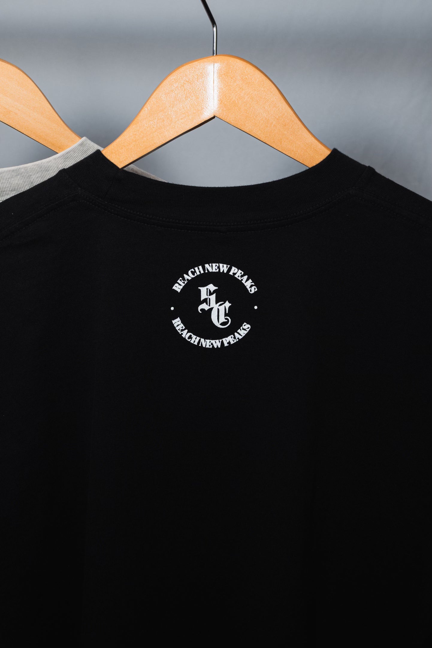 Reach New Peaks Black Tee